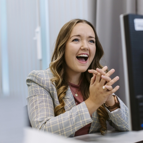 Girl at computer smiling