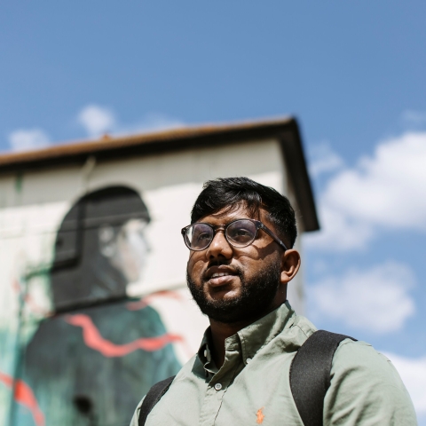 UoP student by London building