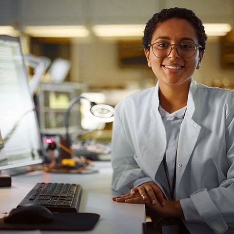Girl at computer smiling