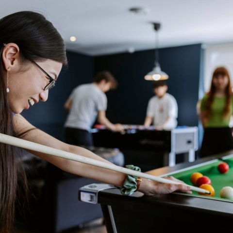 Student playing pool