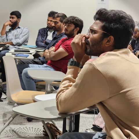 Students sitting in classroom looking into the distance