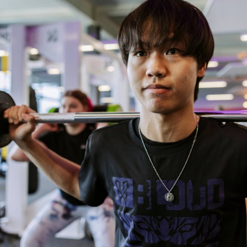Student exercising in gym