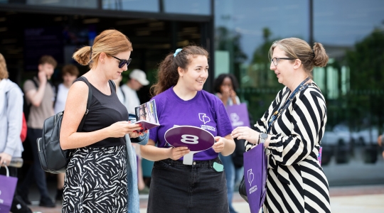 Student ambassador talking and helping visitors  - Open Day 2023