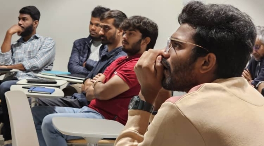 Students sitting in classroom looking into the distance
