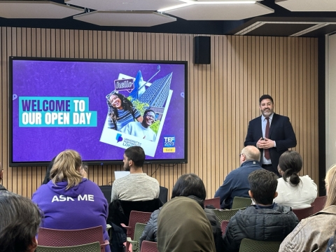 Lecturer giving talk to prospective students_London