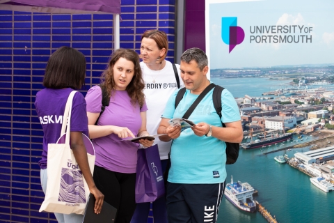 Student ambassador helping family with questions  - Open Day 2023