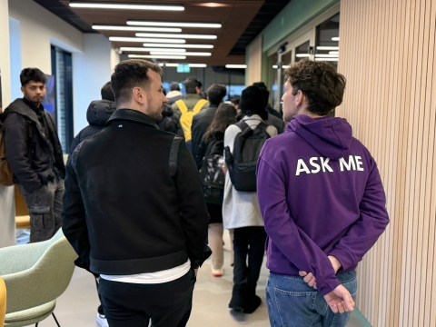 Student Ambassador with a student walking and talking