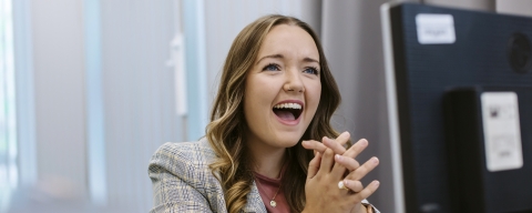 Girl at computer smiling