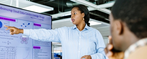 Information analyst looking at data on a monitor