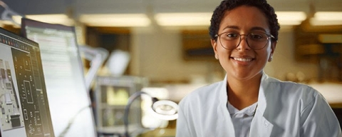 Girl at computer smiling