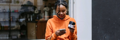 student looking at her phone